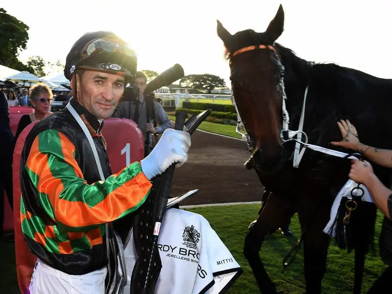 Jockey Corey Brown gestures after riding Sense of Occasion to victory