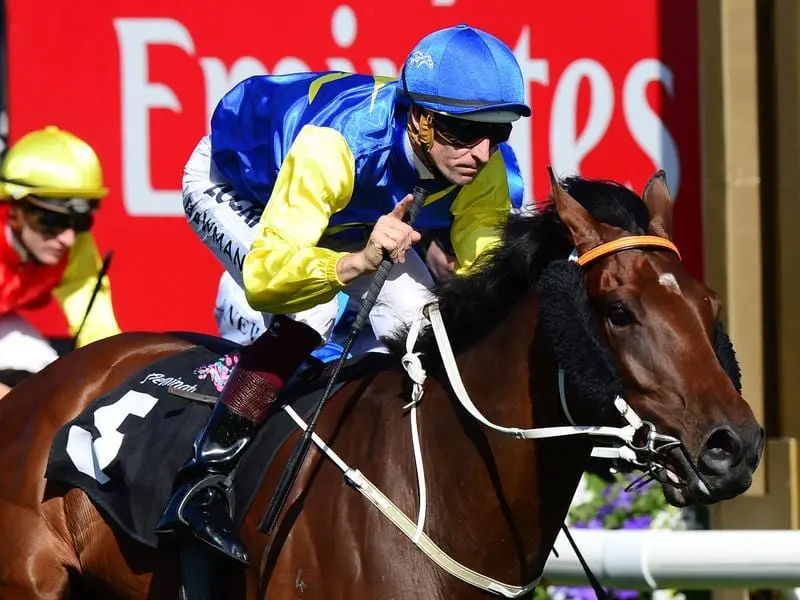 Jockey Hugh Bowman (right) rides Le Romain on Derby Day