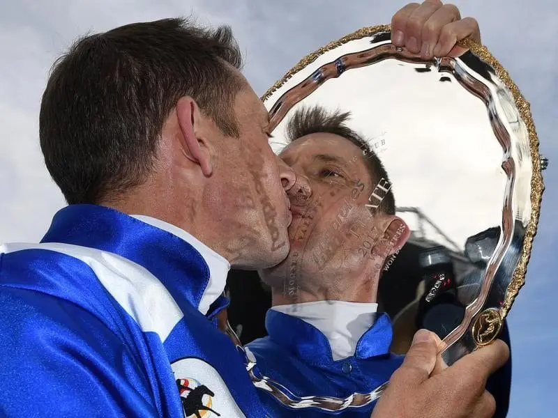 Hugh Bowman and the Cox Plate trophy.