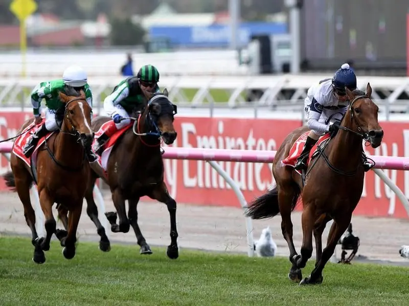 Jockey Stephen Basterat riding Setsuna crosses the finish line.