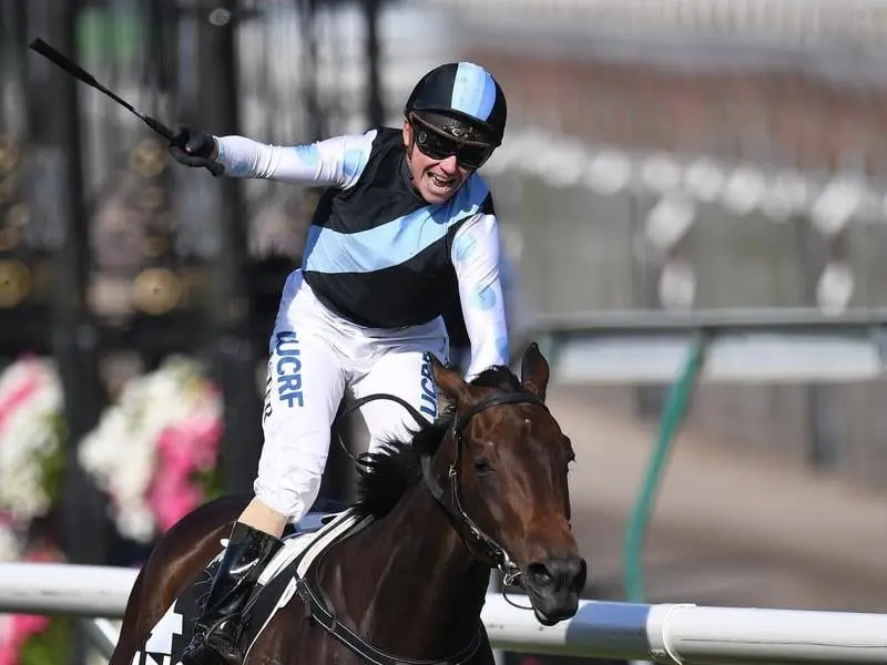 Stephen Baster reacts after winning the Kennedy Oaks on Pinot