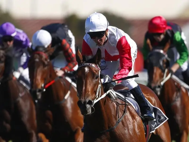 Jockey Kerrin McEvoy (centre) rides Miss Dubois to win race 7.