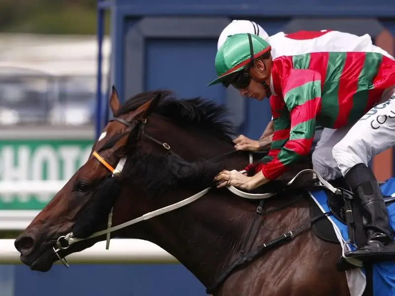 Jockey Jason Collett rides Karavali to win race 1.