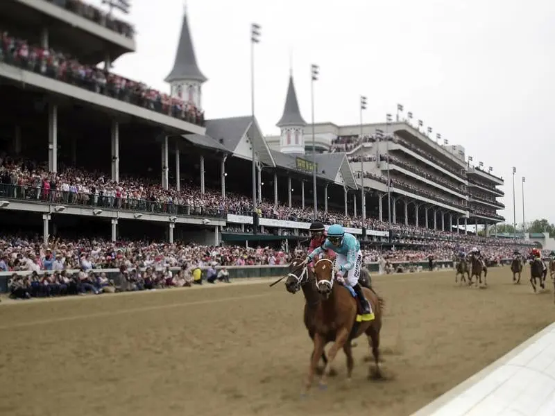 Monomoy Girl (right) wins the Kentucky Oaks.