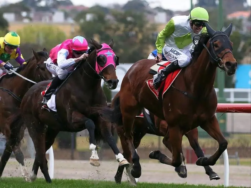 Jockey Dwayne Dunn rides Call Me Handsome (R)