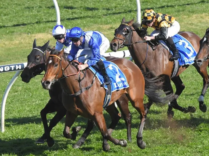 Libertini (right) wins the Furious Stakes.