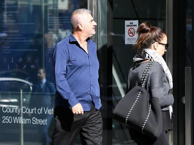 Bill Vlahos (left) arrives to the County Court (file image)