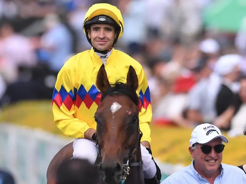 Jockey Michael Rodd returns to scale after the Magic Millions Cup.