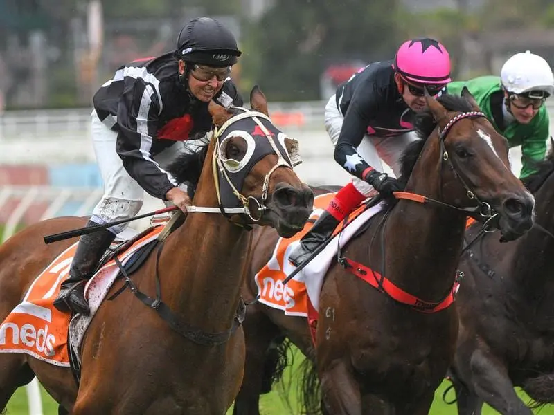 Jockey Jade Darose (l) rides Jungle Edge to victory in the WJ Adams Stakes in February. Jungle Edge
