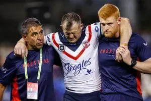 Roosters trainers help off Brett Morris after career-ending ACL tear