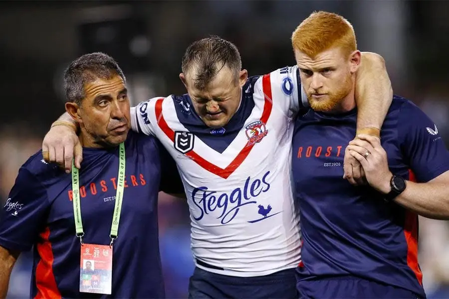 Roosters trainers with Brett Morris after career-ending ACL tear