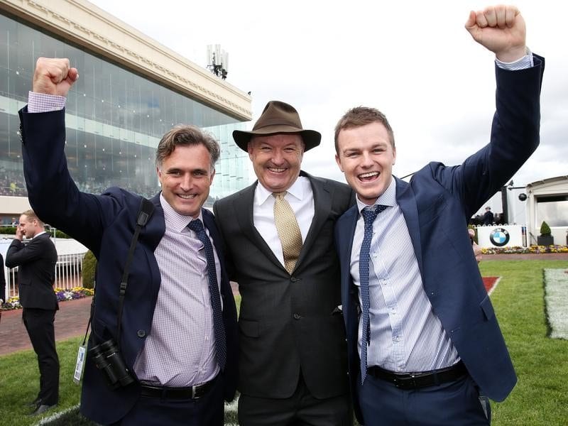 Caulfield Cup winner Boom Time's trainers celebrate