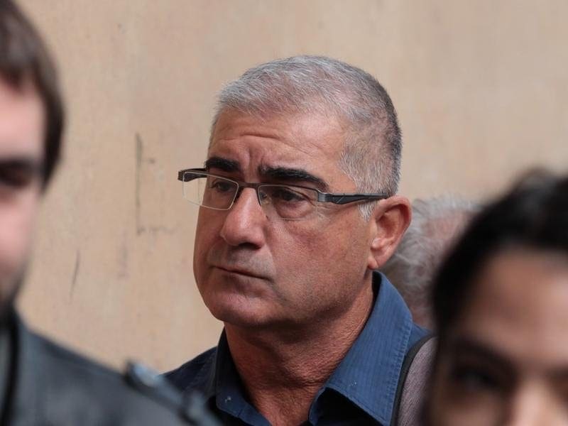 Bill Vlahos has pleaded not guilty to 350 charges related to his BC3 Thoroughbreds syndicate. Bill Vlahos (centre) arrives at the Melbourne Magistrates Court
